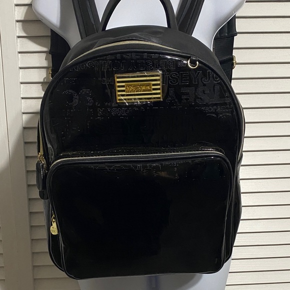 Betsey Johnson Handbags - Betsey Paten leather Black Backpack with Gold Details